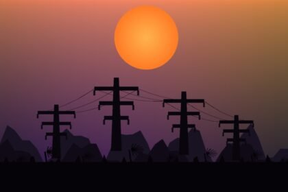 Pylônes électriques silhouettés contre un ciel tropical au coucher du soleil en Nouvelle-Calédonie