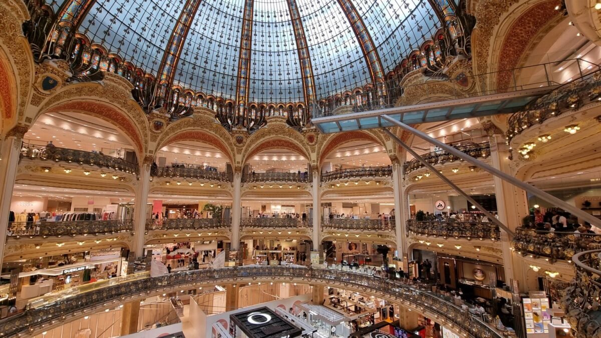 Stunning interior view of the Galeries Lafayette dome in Paris, France, highlighting intricate architecture.